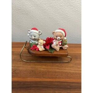 Vintage small sleigh holiday decor with teddy bears, a mouse and poinsettias